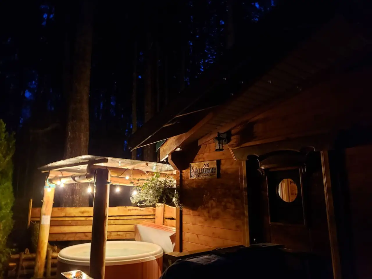 A private evergreen lodge located in a peaceful wooded area, offering a secluded retreat amidst nature.